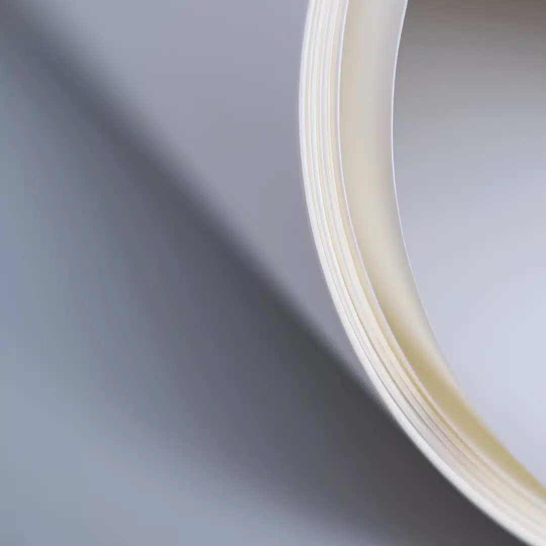 Roll of bright white paper, showing subtle tone variations
