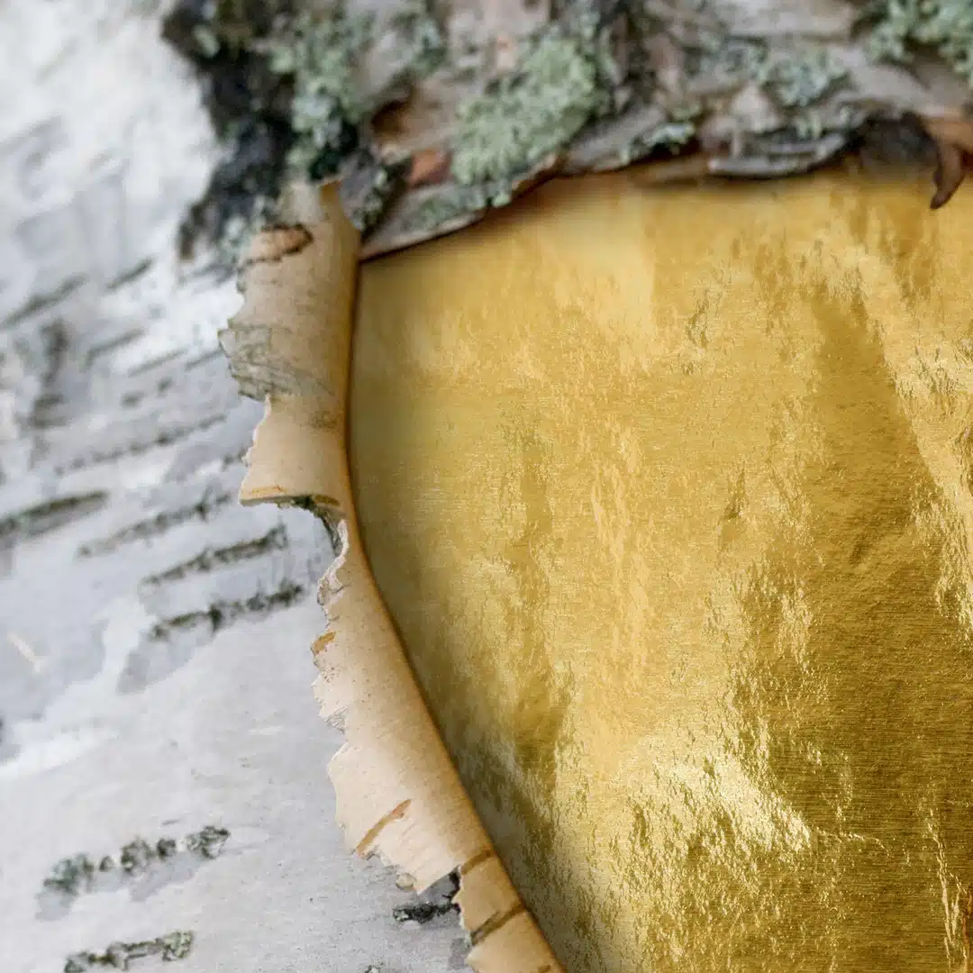 Gold-textured birch with sustainable material them